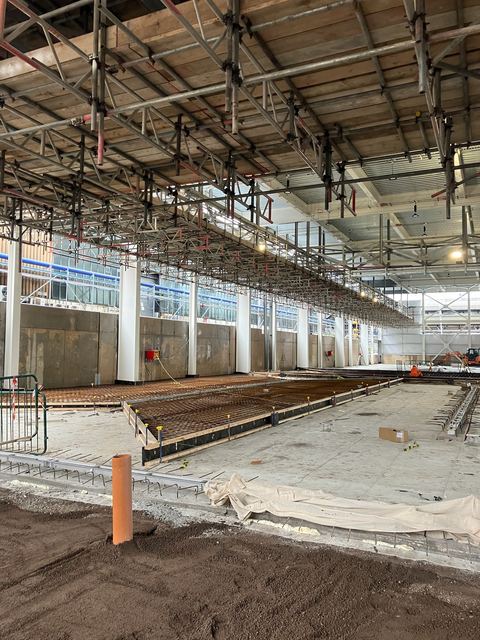 Suspended access scaffold built off existing steelwork beneath the roof of the InBev brewery at Magor