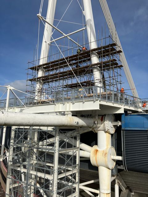 Scaffold rising against the mast and roof structure of the Principality Stadium