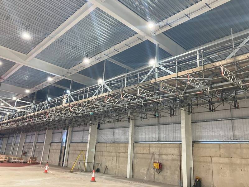 Suspended access scaffold built off existing steelwork inside the InBev brewery at Magor